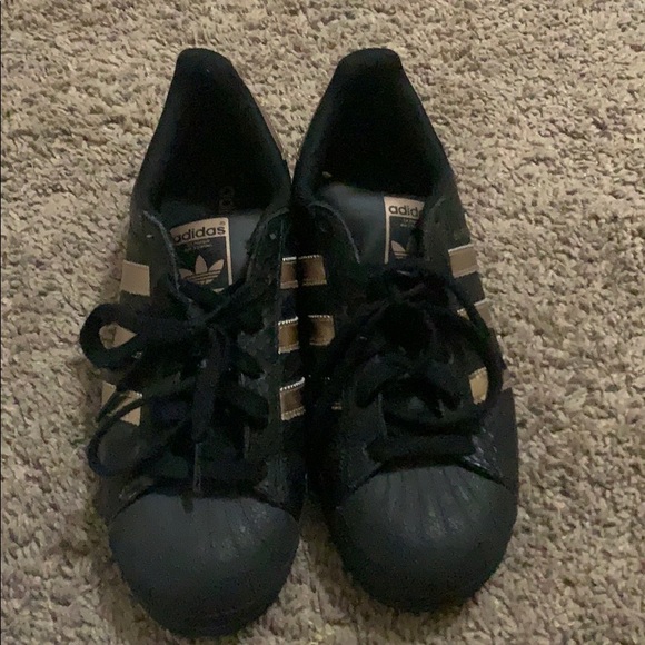 black and rose gold shell toe